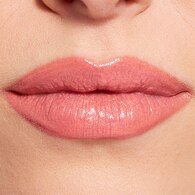 REVOLUTION POUT LIP GLOSS STICK SHIM. PEACH SORBET